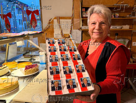 Ursula Trump presents pastries decorated with an eatable portrait of U.S. President-elect Donald Trump in a bakery in Freinsheim