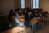 Students in a classroom after authorities announced the reopening of schools, in Damascus