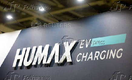A Humax EV Charging logo on display at the Everything Electric exhibition