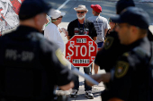 Parliamentary Protective Service members and protestors gather outside of West Block on Parliament Hill as parliamentary business resumes after the summer recess in Ottawa