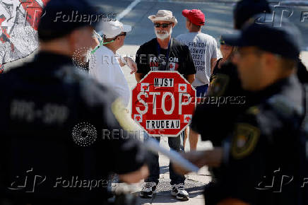 Parliamentary Protective Service members and protestors gather outside of West Block on Parliament Hill as parliamentary business resumes after the summer recess in Ottawa