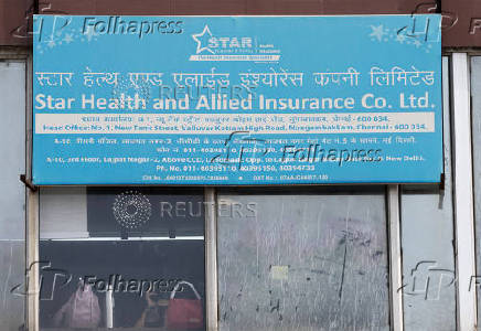 An employee of Star Health sits inside their office, in New Delhi