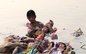 Immersion of idols on the last day of Durga Puja festival in India