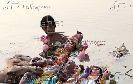 Immersion of idols on the last day of Durga Puja festival in India