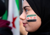 Syrian-Americans and supporters celebrate after Syrian rebels announced that they had ousted Syrian President Bashar al- Assad in Syria, in Dearborn, Michigan,