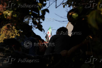 Former members of Syria's Bashar Al Assad's security forces wait to register for the identification and reconciliation process, in Damascus