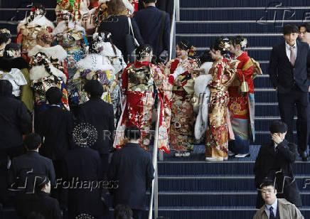 Youth including Kimono-clad women gather at the venue for their Coming of Age Day celebration ceremony in Yokohama