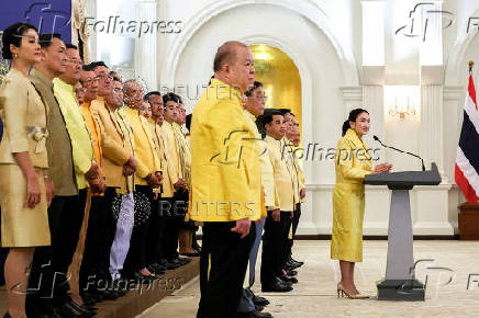 Thailand's Prime Minister Paetongtarn Shinawatra and her cabinet members attend a press conference in Bangkok