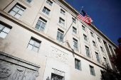 A U.S. flag flutters at the Federal Trade Commission (FTC) headquarters in Washington, D.C.