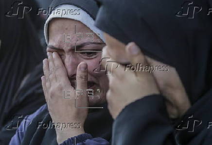 Palestinians mourn their dead at Deir Al Balah hospital after Israeli airstrike in central Gaza