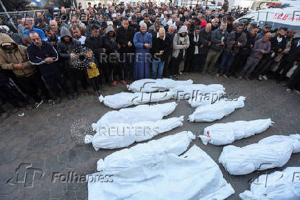 Palestinians mourn loved ones killed in Israeli strikes, in Deir Al-Balah in the central Gaza Strip