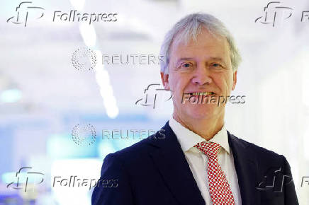 FILE PHOTO: Peter Wennink, President and CEO of Dutch chip machine maker ASML poses after announcing Q4 results in Veldhoven