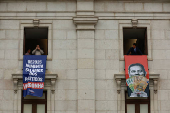 Far-right political party Chega expose banners on the facade of the Portuguese parliament against the wage reinstatement for politicians after the cuts imposed by the Troika, during the debate and vote of the 2025 budget bill on final reading, in Lisbon