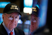 FILE PHOTO: Art Cashin, Director of Floor Operations at UBS, wears a DOW 24,000 hat as he works on the floor of the NYSE as the Dow Jones Industrial Average crosses 24,000, in New York