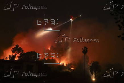 Firefighters battle the Sunset Wildfire in Los Angeles, California