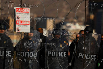 Members of U.S. Customs and Border Protection (CBP) perform a drill at the Paso del Norte International border bridge, as seen from Ciudad Juarez