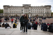 People visit Buckingham Palace, in London