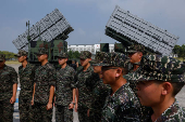 Members of the Taiwanese navy Hai Feng (Sea Blade) Group listen briefing in front of Hsiung Feng III and II mobile missile launchers after Taiwanese President Lai Ching-te?s visit to the base in response to recent Chinese military drills, in Taoyuan