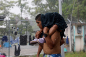 Migrant caravan stops to rest before moving on its way to the U.S.-Mexico border, in Escuintla