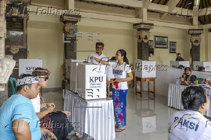 Voters cast their ballots in regional government elections in Indonesia