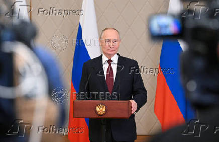 Russian President Putin attends a press conference in Astana