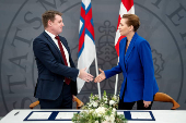 Denmark's Prime Minister Mette Frederiksen and the Faroese Prime Minister Aksel V. Johannesen sign a joint request to the Danish Supreme Court, in Prime Minister's Office, in Copenhagen