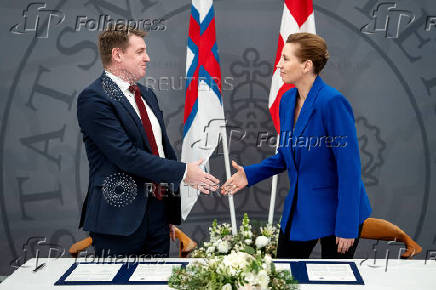 Denmark's Prime Minister Mette Frederiksen and the Faroese Prime Minister Aksel V. Johannesen sign a joint request to the Danish Supreme Court, in Prime Minister's Office, in Copenhagen