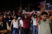 Kashmiri Shia Muslims shout slogans during a protest against Israel following the killing of Hezbollah leader Nasrallah in an Israeli airstrike in Beirut, in Srinagar