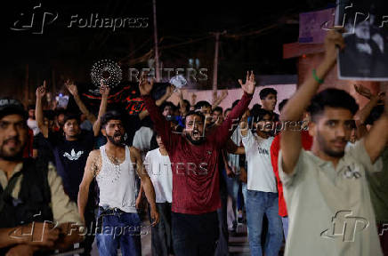 Kashmiri Shia Muslims shout slogans during a protest against Israel following the killing of Hezbollah leader Nasrallah in an Israeli airstrike in Beirut, in Srinagar