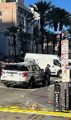 Police attend the scene where a pickup truck drove into a large crowd on Bourbon Street