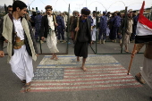 Houthi supporters protest againt the US and Israel in Sana'a