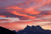 FILE PHOTO: A mountain range at sunset is pictured in Switzerland