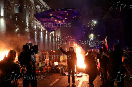 Supporters of Georgia's opposition attend a rally to protest, after government halts EU application until 2028, in Tbilisi