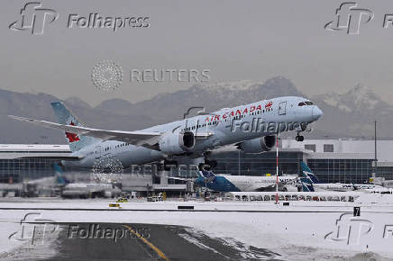 FILE PHOTO: Air Canada plane takes off from Vancouver International Airport in British Columbia, Canada