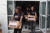 Boxes of supplies are distributed to the poor in Lagos