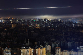 A Lebanese Middle East Airlines (MEA) aircraft flies over Beirut's southern suburbs