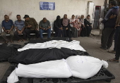 Palestinians mourn their dead following airstrike on Rafah, southern Gaza
