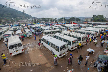 Public transport buses wait for passengers at the terminus stop in the outskirts Kigali,