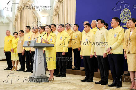 Thailand's Prime Minister Paetongtarn Shinawatra and her cabinet members attend a press conference in Bangkok