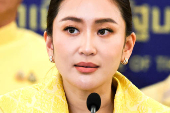 Thailand's Prime Minister Paetongtarn Shinawatra and her cabinet members attend a press conference in Bangkok