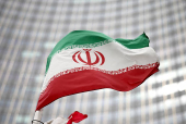 FILE PHOTO: Iranian flag flies in front of the UN office building in Vienna