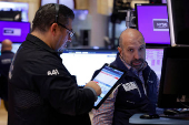 Traders work on the floor of the NYSE in New York