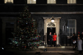 British Prime Minister Starmer and his wife switch on the Downing Street Christmas tree lights, in London