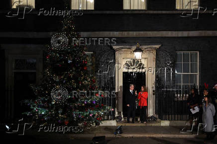 British Prime Minister Starmer and his wife switch on the Downing Street Christmas tree lights, in London