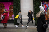 Shoppers walk on Oxford Street in London