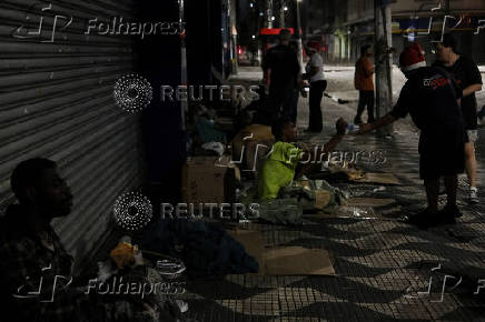 Anjos da Noite (Night Angels) NGO distributes food to homeless people on Christmas Eve in Sao Paulo