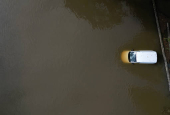 A drone view shows a stranded vehicle at White Mills Marina after heavy rain and flooding in Northampton