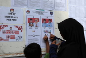 Voters cast their ballows in regional government elections in Indonesia