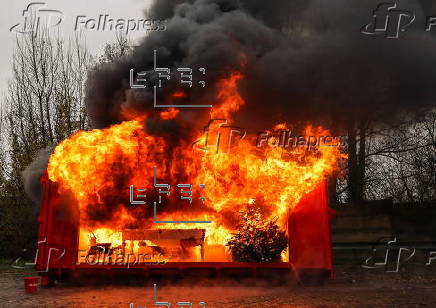 Fire department in Berlin demonstrates fire hazard from Christmas tree candles