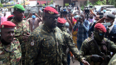 FILE PHOTO: FILE PHOTO: Special forces commander Mamady Doumbouya, who ousted President Conde, walks out after meeting the envoys from ECOWAS about the Guinea crisis to discuss ways steer the country back toward a constitutional